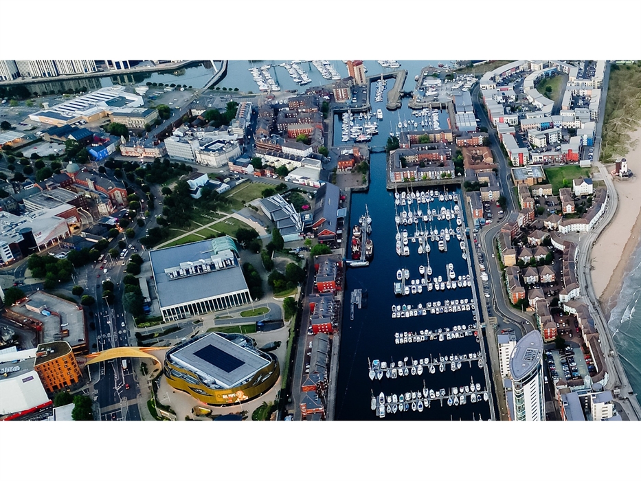 Visit Swansea Bay - drone image taken high over Swansea civic centre towards Marina docks