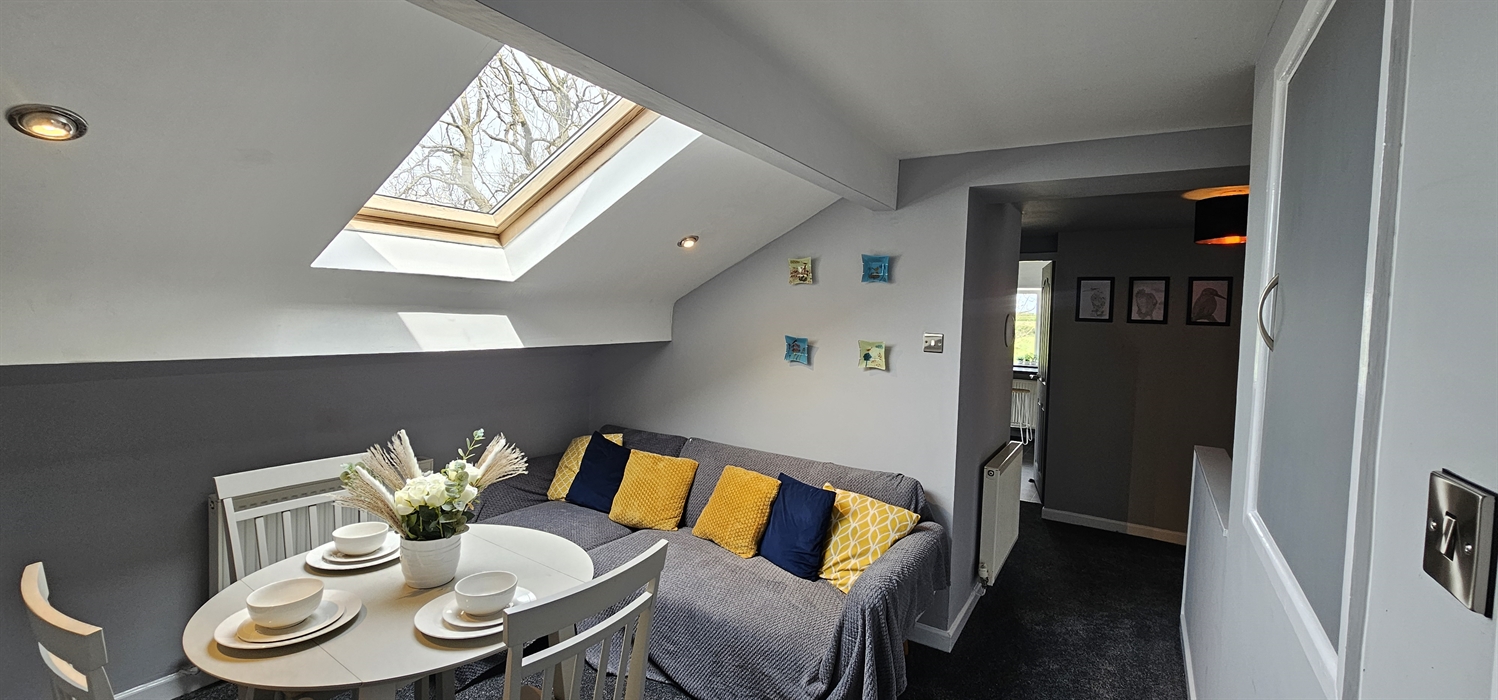 The Redford Cwtch Lounge – a cosy, welcoming space with soft seating, warm lighting, and rustic charm, perfect for relaxing with family or friends aft