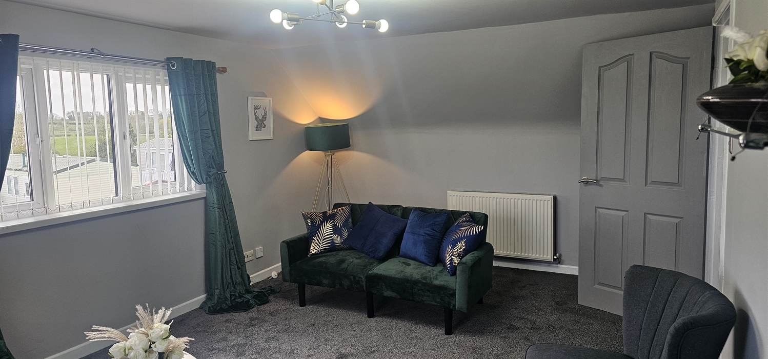 The Redford Cwtch Lounge – a cosy, welcoming space with soft seating, warm lighting, and rustic charm, perfect for relaxing with family or friends aft
