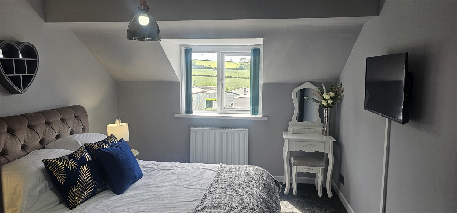 The Redford Cwtch Lounge – a cosy, welcoming space with soft seating, warm lighting, and rustic charm, perfect for relaxing with family or friends aft