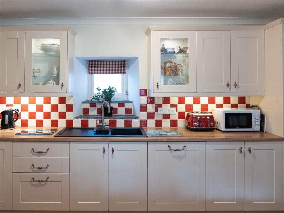 Large farmhouse kitchen with plenty of crockery, cutlery etc for cooking