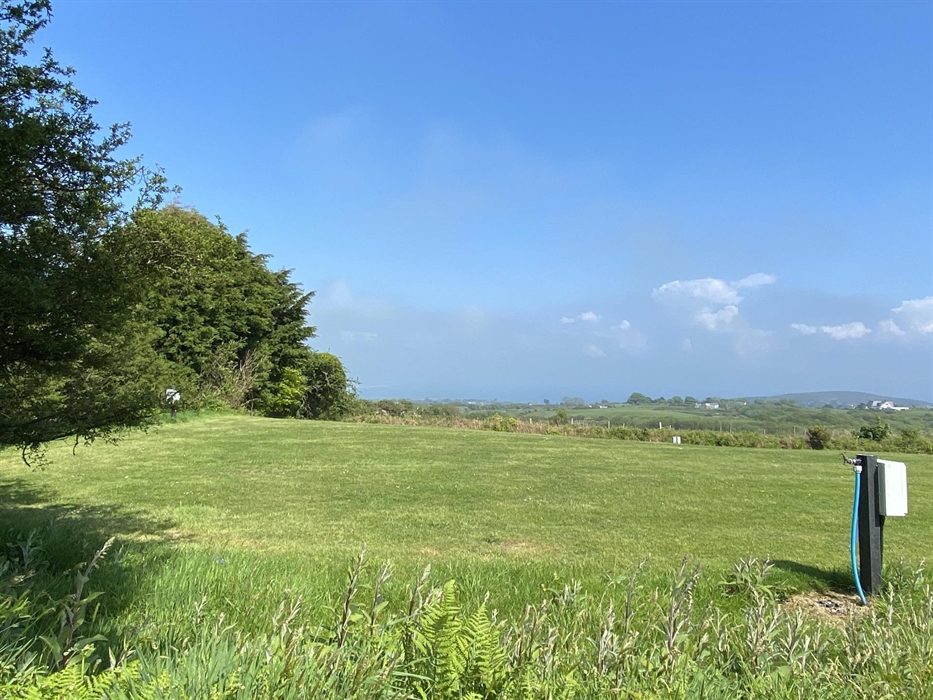 Stunning views from some of our grass pitches - looking onto Snowdonia and Cardigan Bay