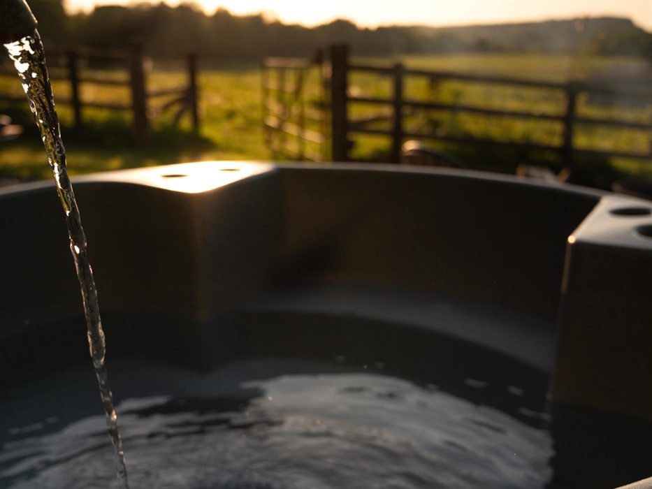 Private wood burning hot tub overlooking the farm, welcome logs provided with instructions to heat (takes 2 hours to heat perfectly)
