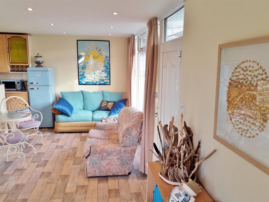 There is plenty of room in the open plan and beach - themed cabin.