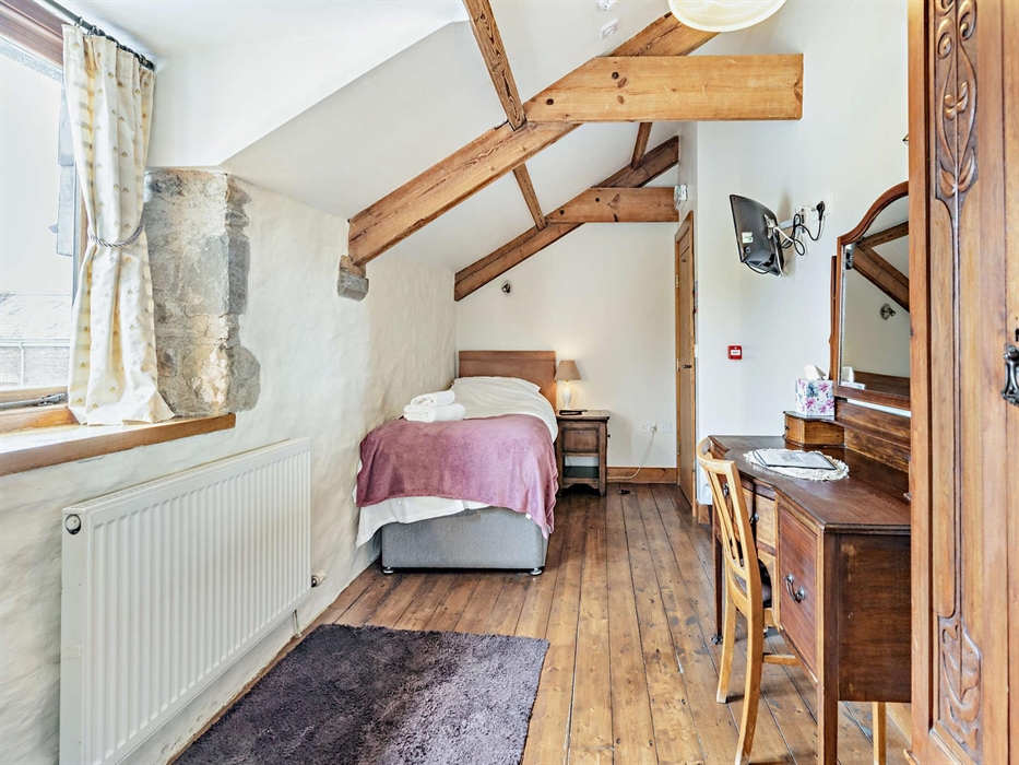 Room 5, sleeps 1 with a single bed & a shower en-suite