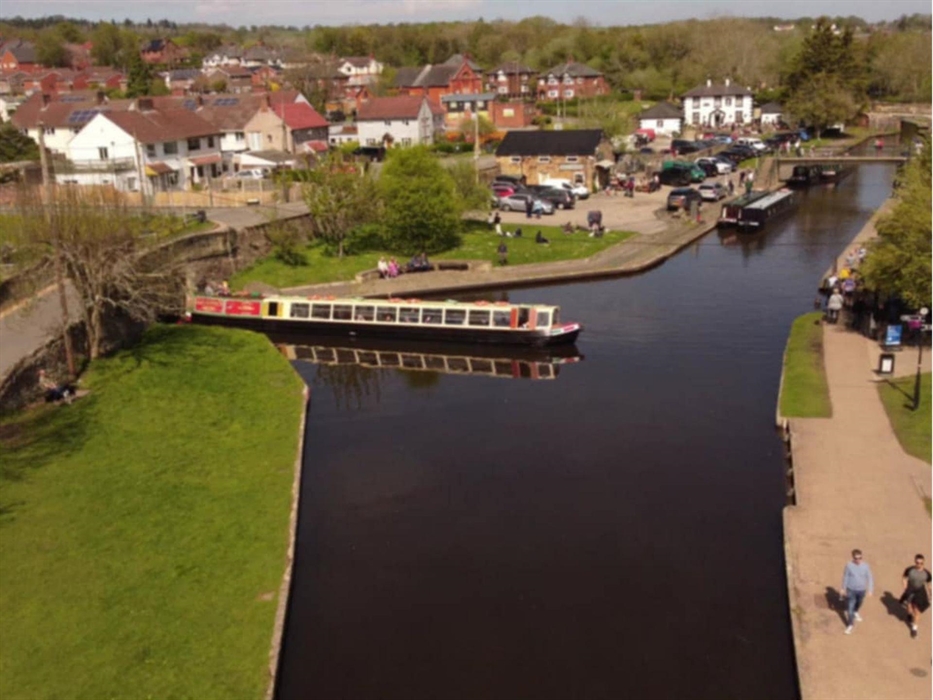 In this scene, Llangollen Wharf's Motorised Canal Boat Thomas Telford has arrived at Trevor Basin and is preparing to turn to cross the Poncysyllte Aq