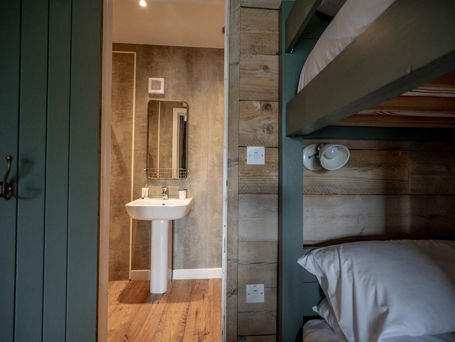 Each Llechwedd Glamping Tent has a fully en-suite shower room with sink and toilet.