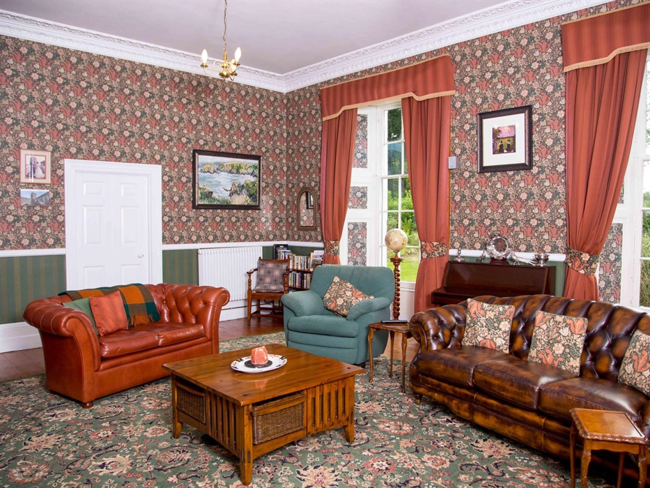 This spacious room is changing during the year the log fire in spring and autumn gives the warm glow to relax and read -or slumber