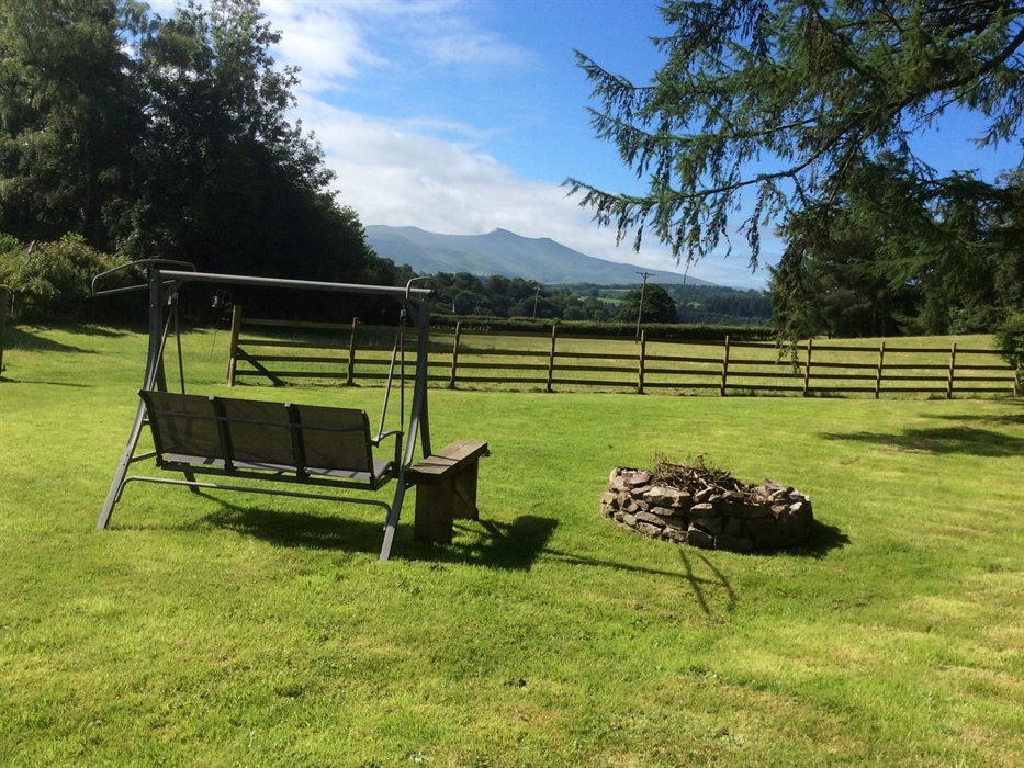 You will have a panoramic view of Pen Y Fan from the swing seat.