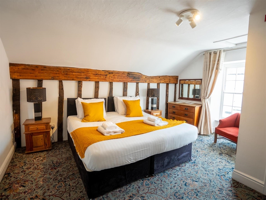 A room with a king size bed