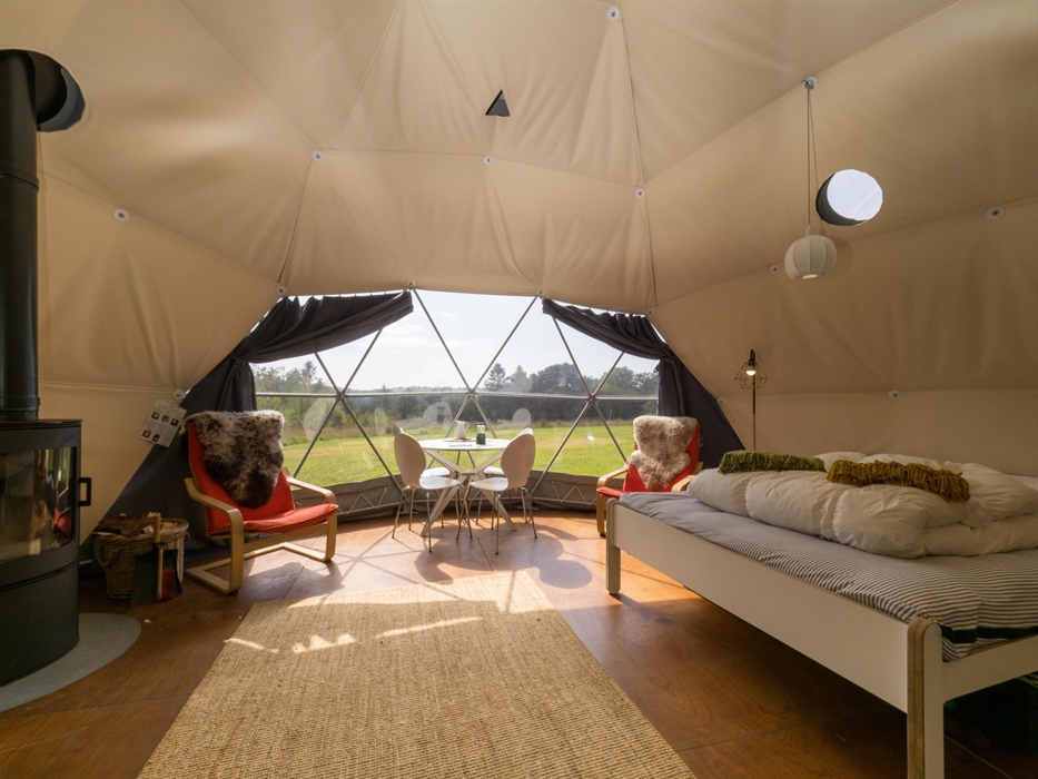 Bright and airy inside the Nature Domes include a wood burner for a lovely warm evening fire, and comfortable accommodation for up to four people.
