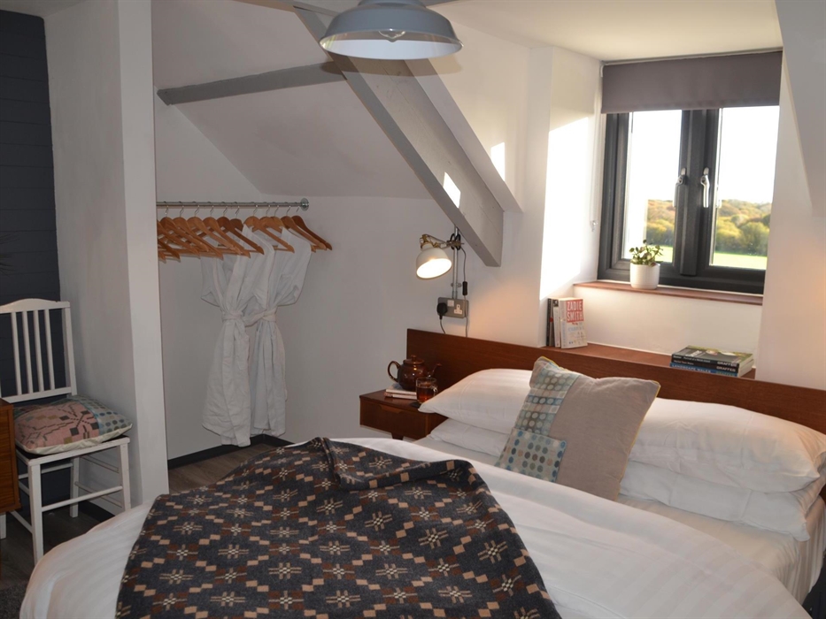 Bright double bedroom with countryside views.