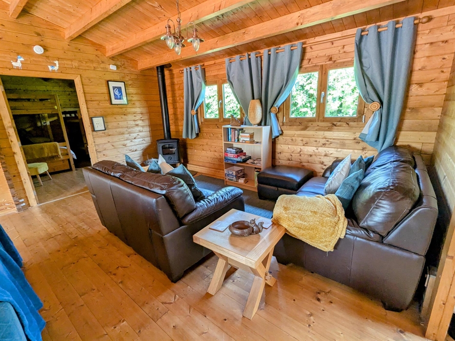 Mam cabin living room log burner view to bunk room