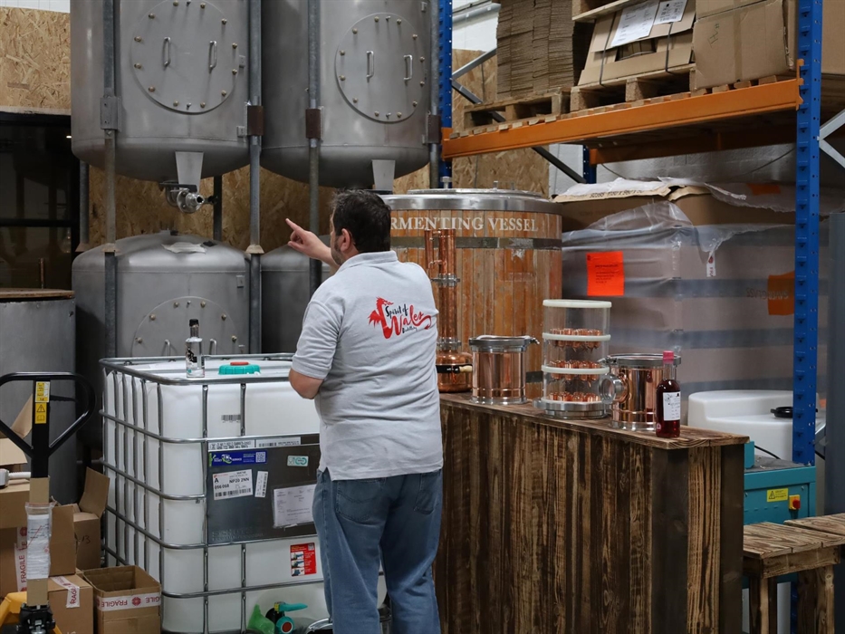 Dan giving a distillery tour and showing the stills.