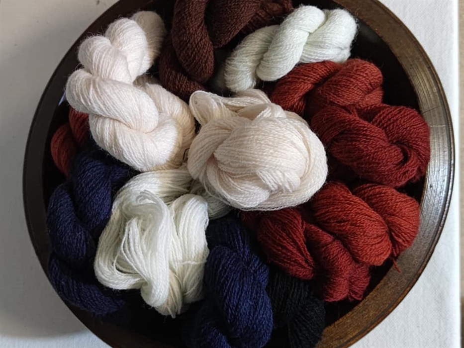 Weaving Yarns in a traditional pallet of Indigo Madder and Natural Whites