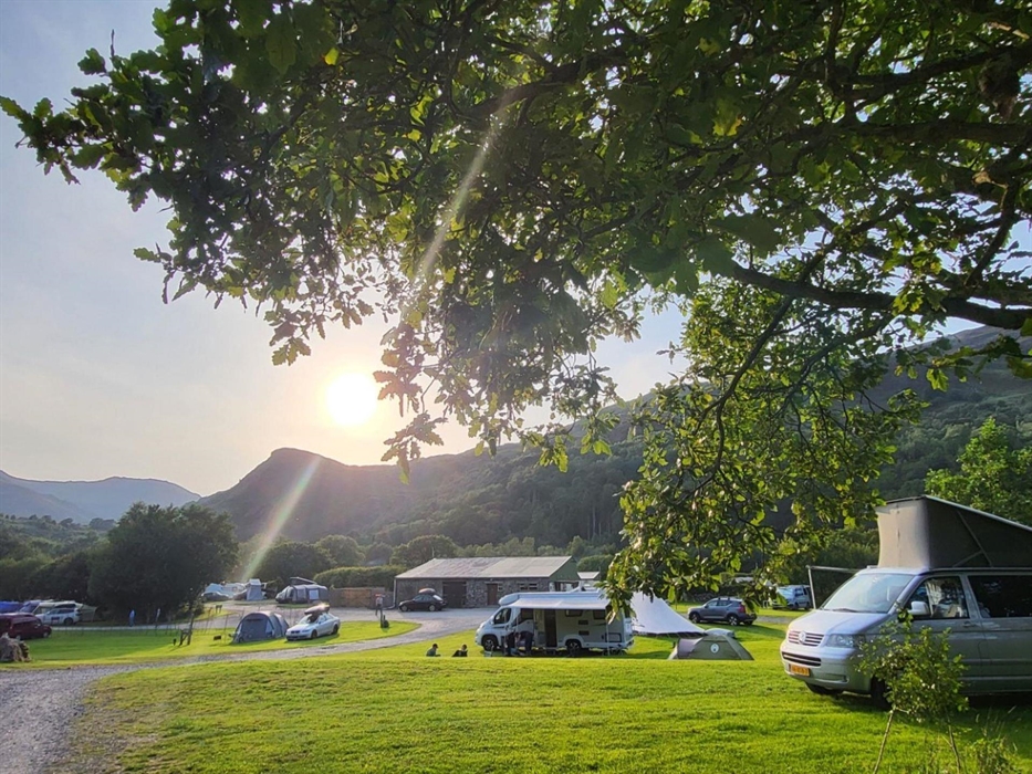 View of Cae Du campsite with motorhomes, campervans and tents