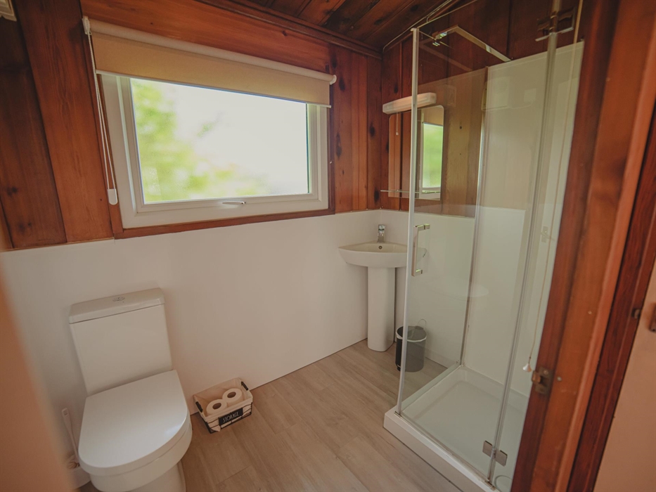 Timber Hill lodge bathroom has either a bath with a shower over the top or a stand alone shower.