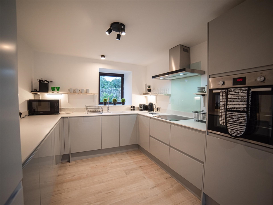 A contemporary kitchen with modern amenities makes meal preparations a breeze, a joy for any culinary enthusiast.