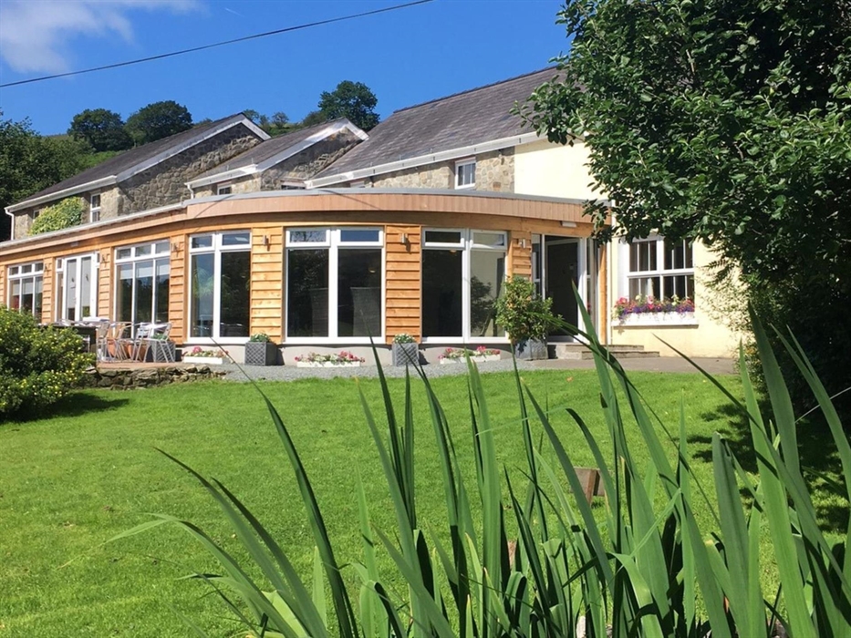 The Guest House from the Garden looking at the Garden room and dining area