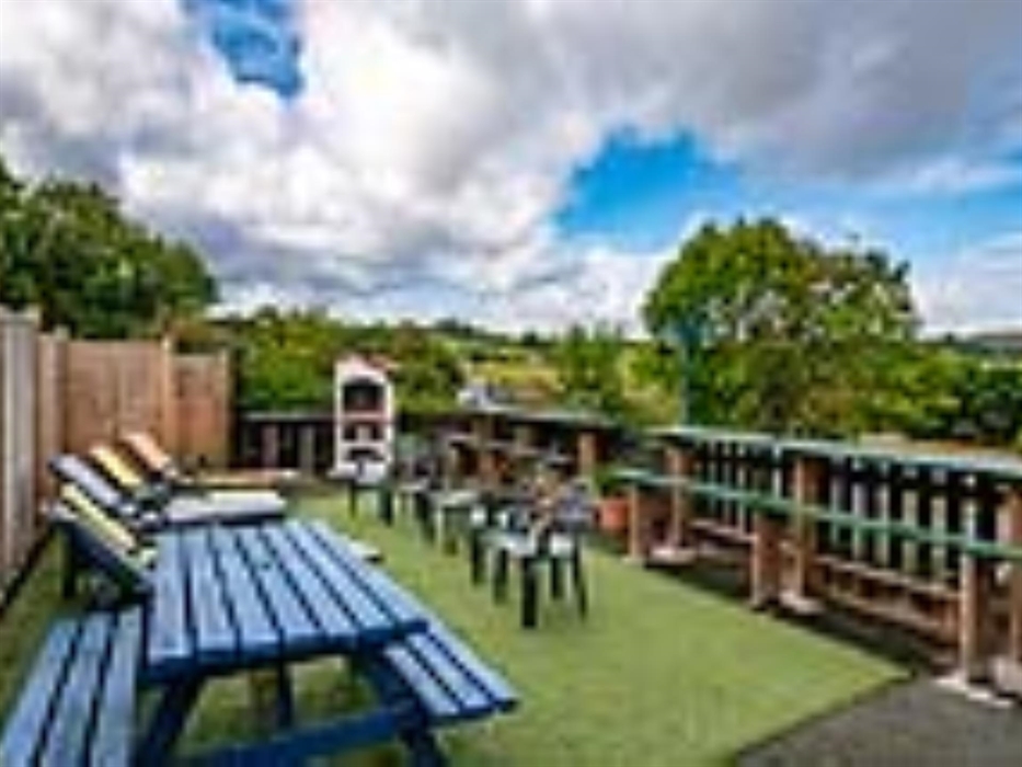 Welsh Row House Garden Views.  Views of Welsh countryside. Sun loungers, Large masonry BBQ and outdoor eating area.