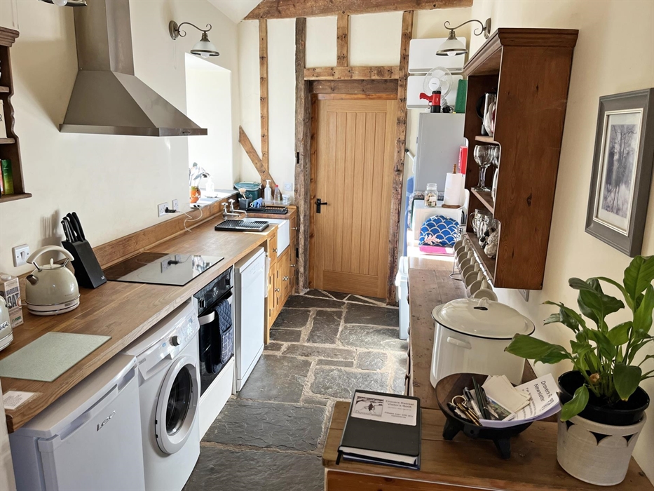 Complete with hob, oven, microwave, fridge, dishwasher, washing machine (and spin drier in games barn), crockery, cutlery, toaster, electric kettle, b