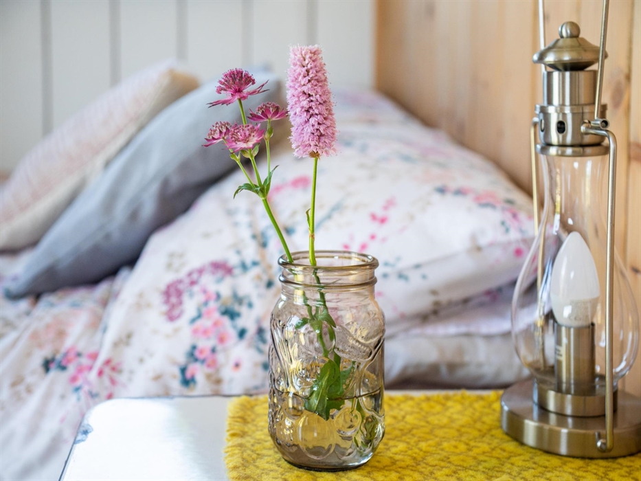 Bed and fresh flowers