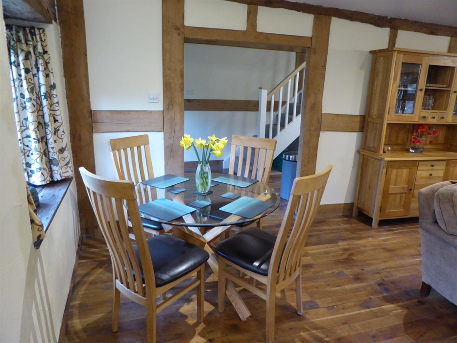 The Farmhouse at Hilltops Brecon Holiday Cottages has a ample sofas, a log-burner and fully fitted kitchen
