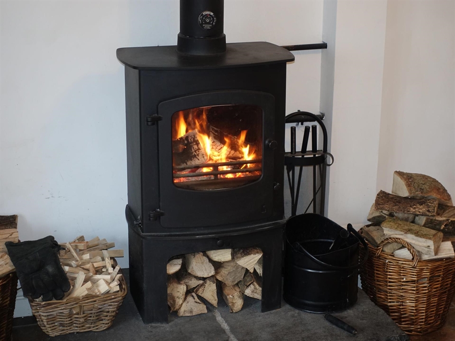 Charnwood B multifuel stove which will run on either logs or anthracite and runs the radiators in all of the other rooms
