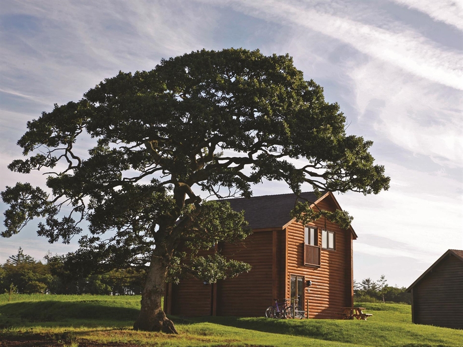 An image of one of Bluestone's luxury lodges, nestled within 500-acres of rolling countryside.