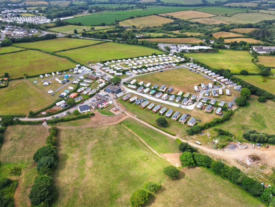 A summer arial shot of the site.