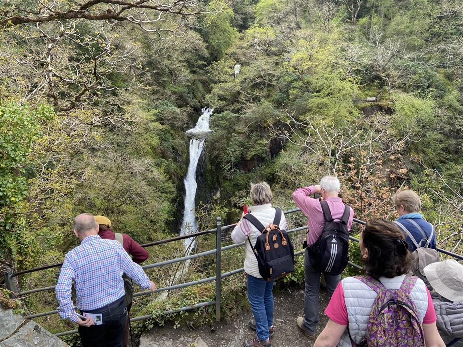 Guests at the bottom of the Devils Bridge Waterfall having climbed down Jacob’s ladder