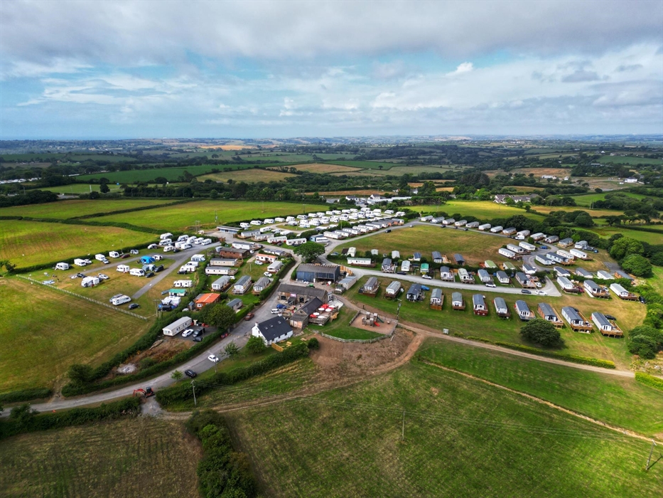 A summer arial shot of the site.