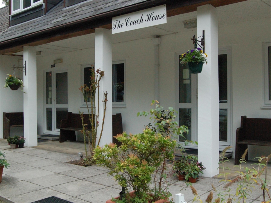 Front veranda and covered seating/smoking area.