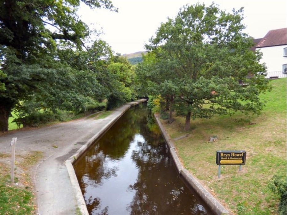 A scenic view of the Llangollen canal at the foot of the Bryn Howell, Llangollen.