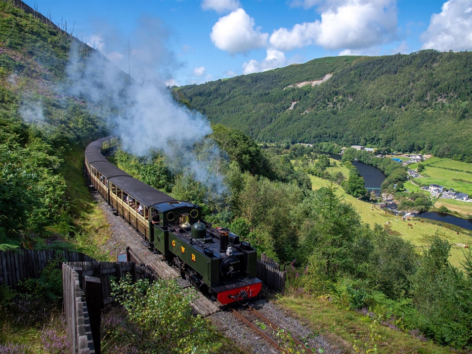 The train climbs along the inside of the Rheidol Valley with a beautiful view of the valley stretching out below.