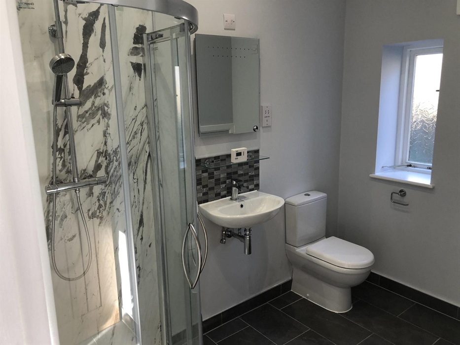 The bathroom in the Skirrid, with shower, sink and toilet
