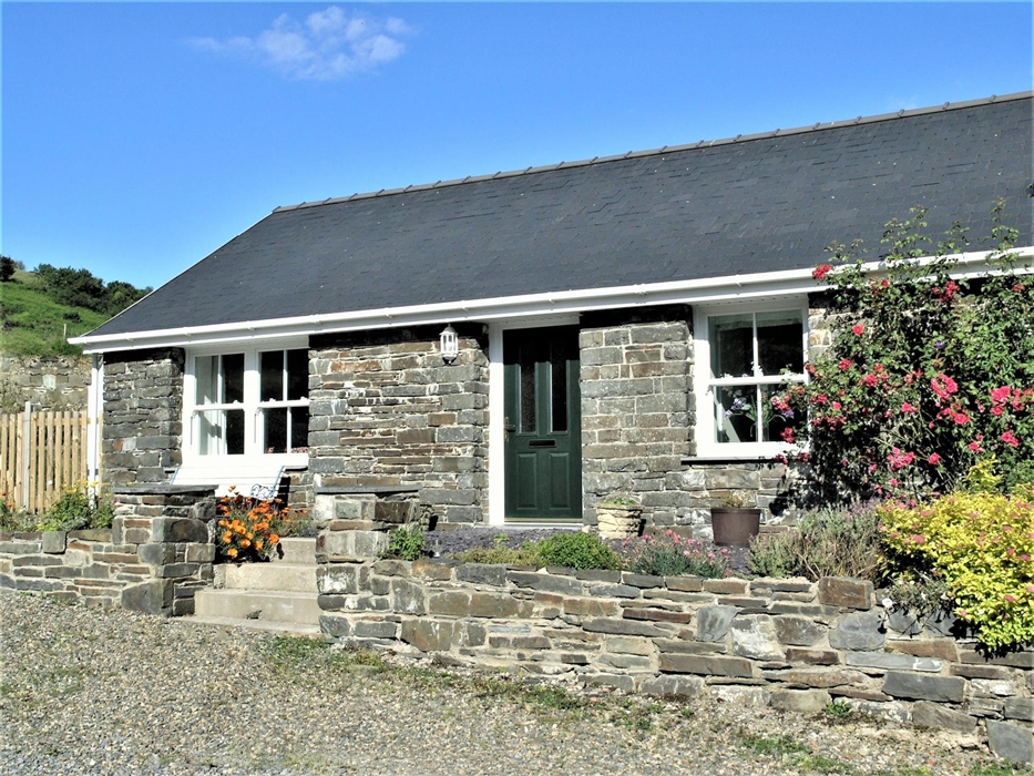Charming stone cottage with plenty of lovely features and outdoor space to enjoy.