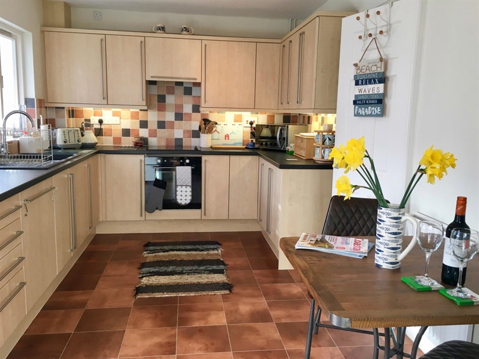 Spacious and well equipped kitchen with dishwasher.  Separate utility area houses washing machine and dryer