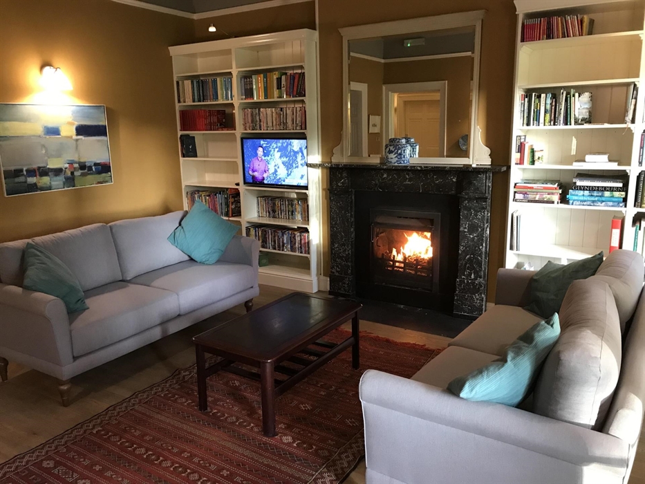 The library has an open log fire and a TV and DVD player with a huge selection of books and DVDs