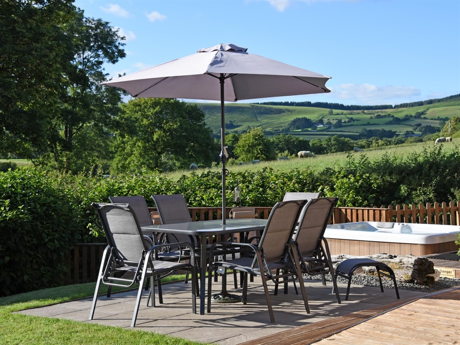 Relax on your private patio overlooking the fields and the countryside views.