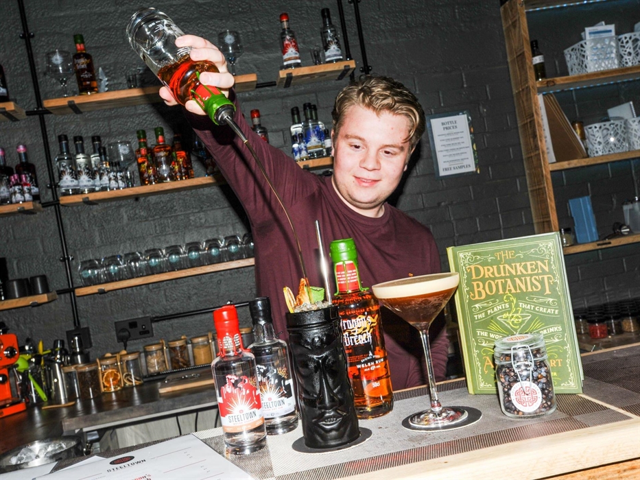 A member of the Spirit of Wales team making cocktails at a Friday Night Tasting