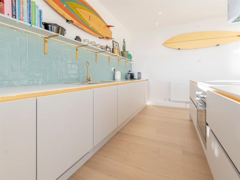 Our brand new modern kitchen benefits from an island, dishwasher and washing machine.