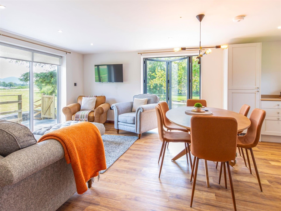 Open plan sitting room with kitchen diner