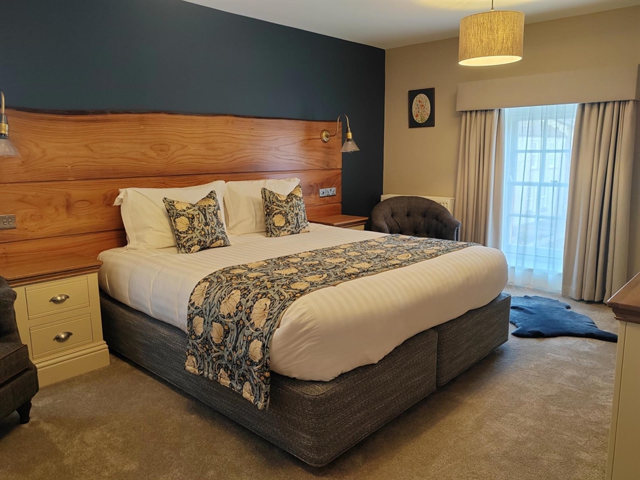 Extra Large super king bed with oak headboard, Room name inspired by the Mabinogion the book of Welsh mythology