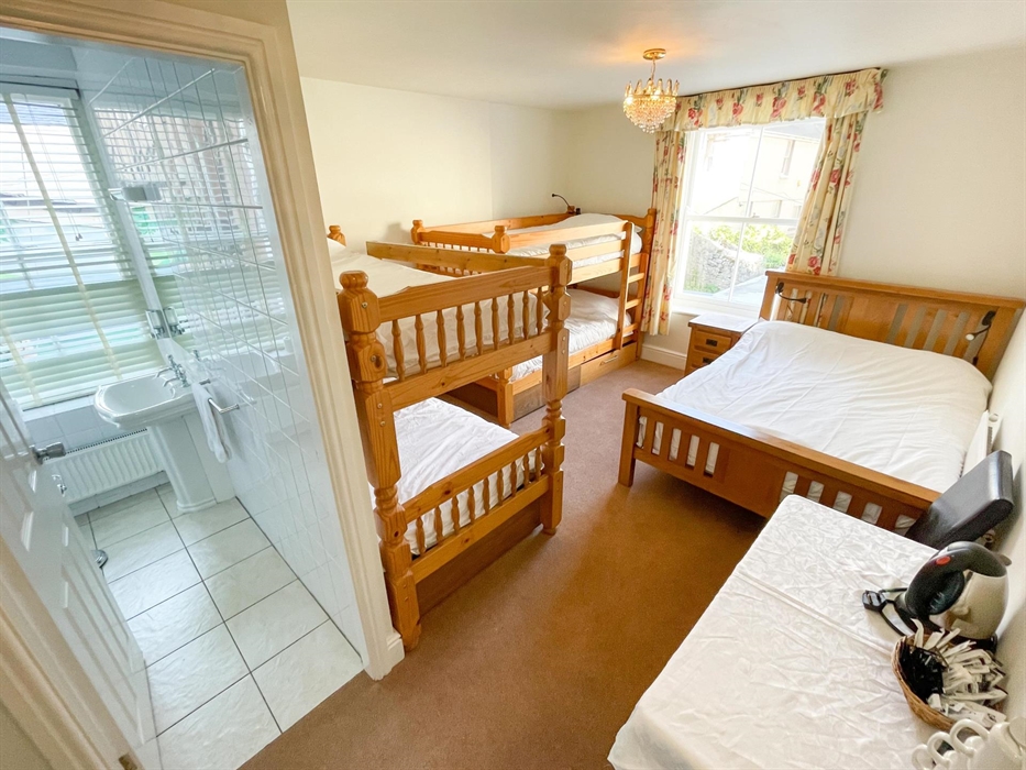 Beautiful family room on the upper ground floor, sleeps 6, double bed and 4 bunk beds.  This room can fit either a fold up extra bed or a cot if requi
