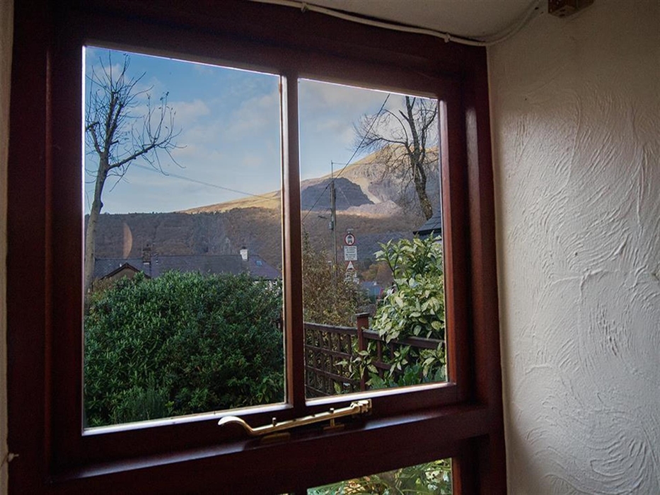 Mount Snowdon can be seen out the window of Y Bwthyn Llanberis