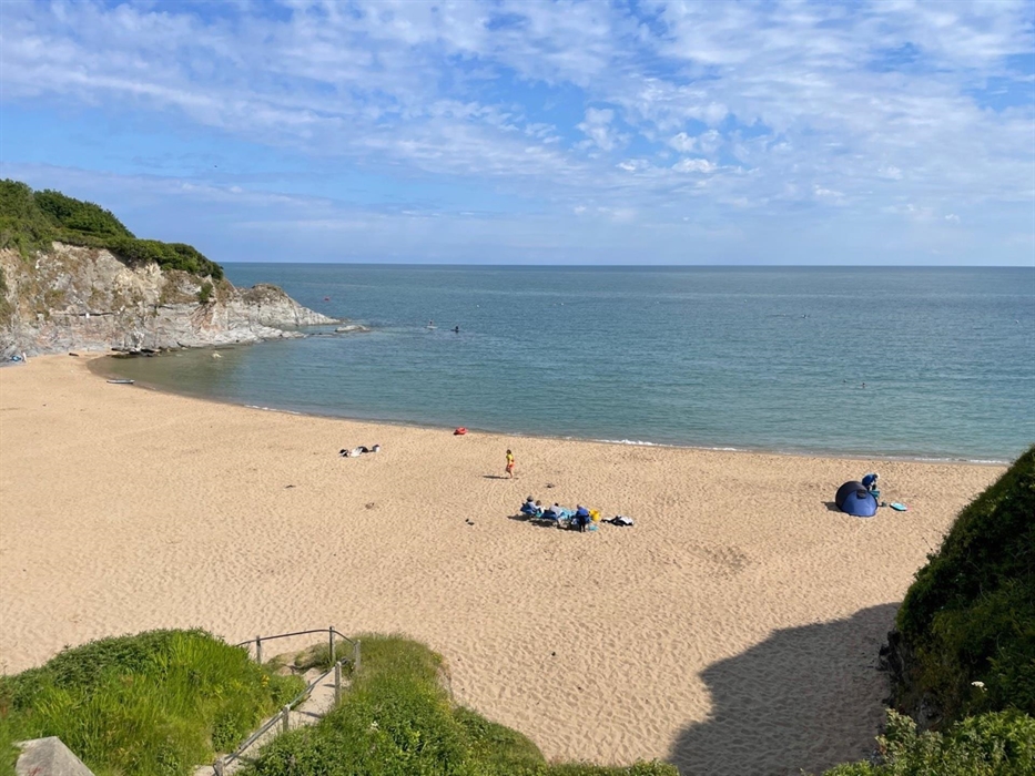 Safe, sandy Dolwen beach ideal for families and all year round swimming