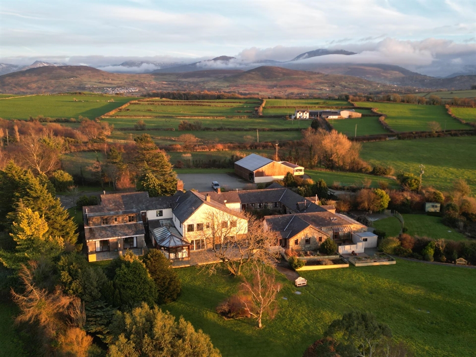 Aerial view of the grounds and exterior of Ty'n Rhos country house