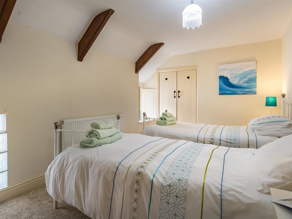 Bedroom 1 with 2 single beds and a view of harbour