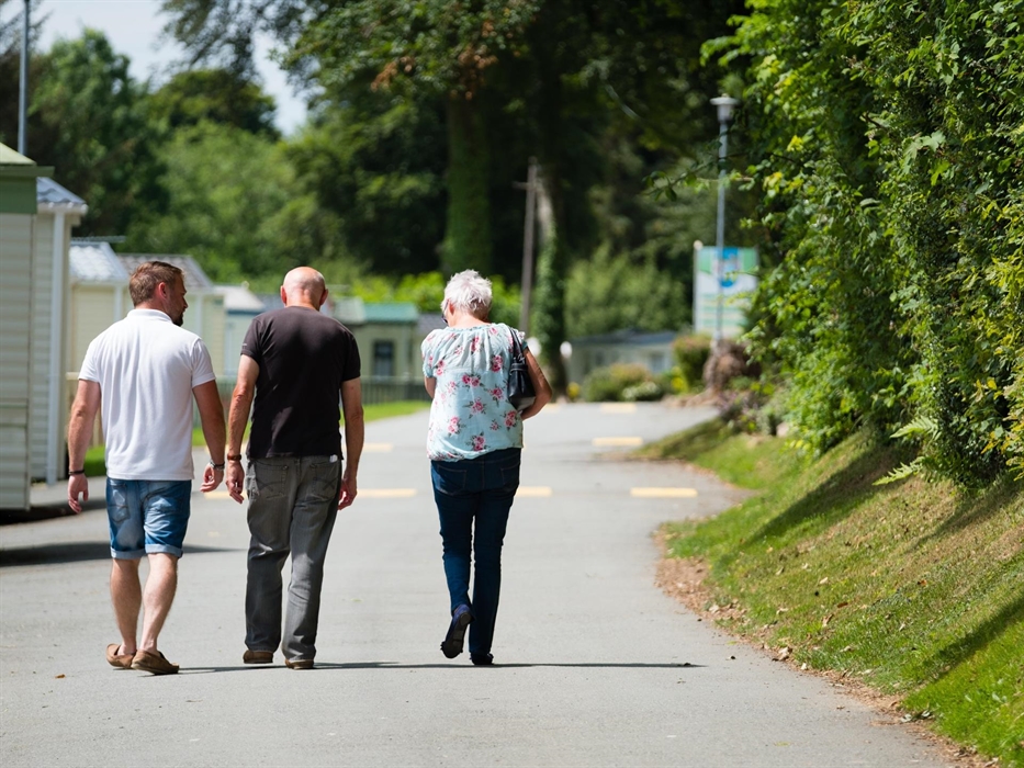 A family going around Grondre Holiday Park